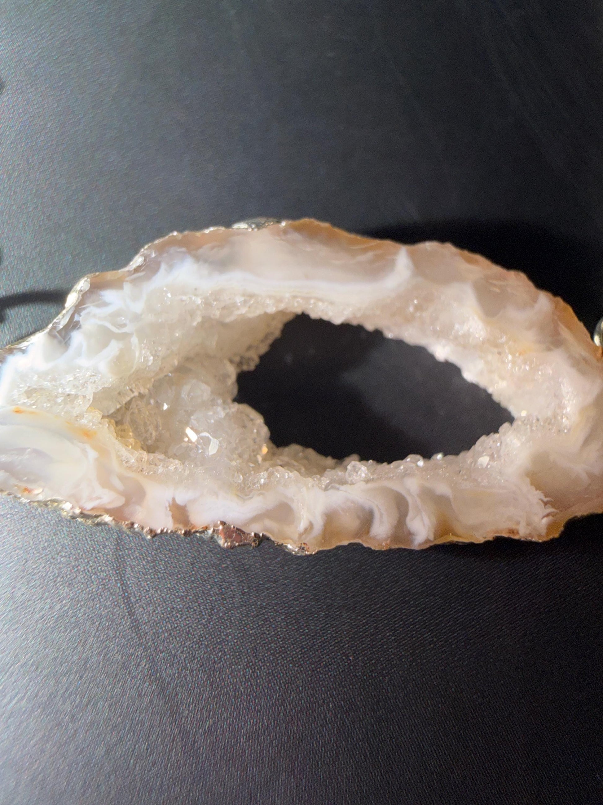 Close-up of a crystal geode on a dark surface