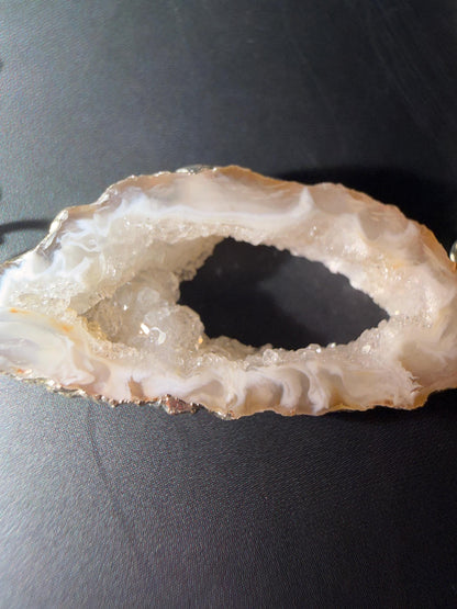 Close-up of a crystal geode on a dark surface