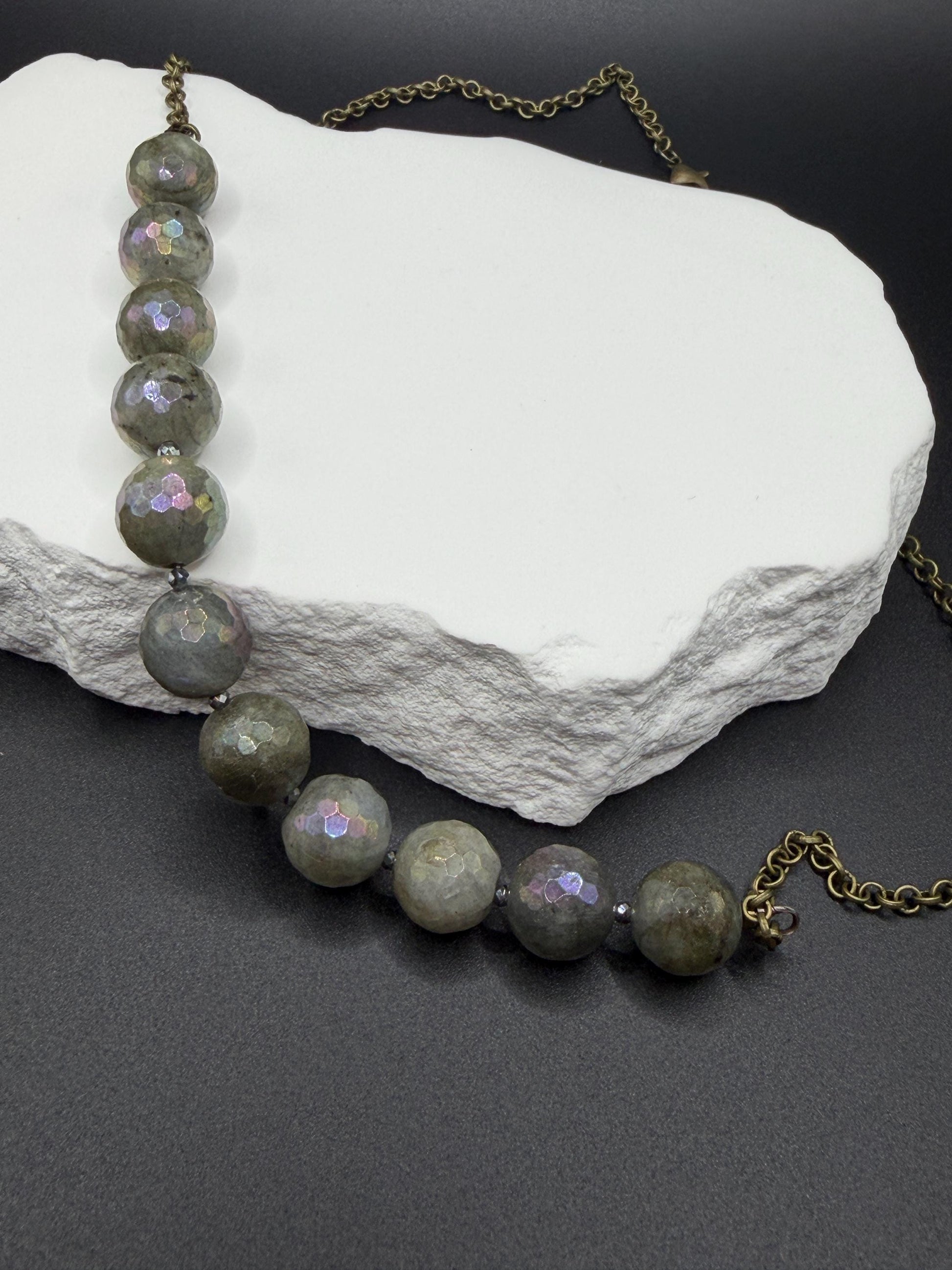Necklace with Labradorite beads on a rock
