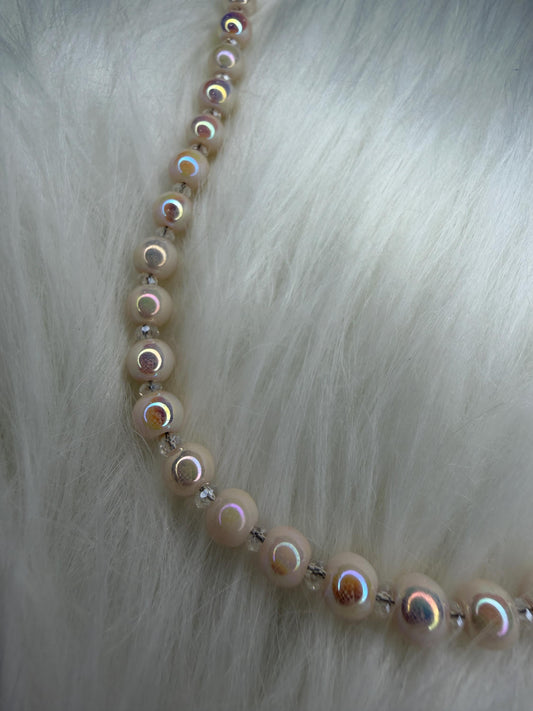 Necklace with round beads on a fur background