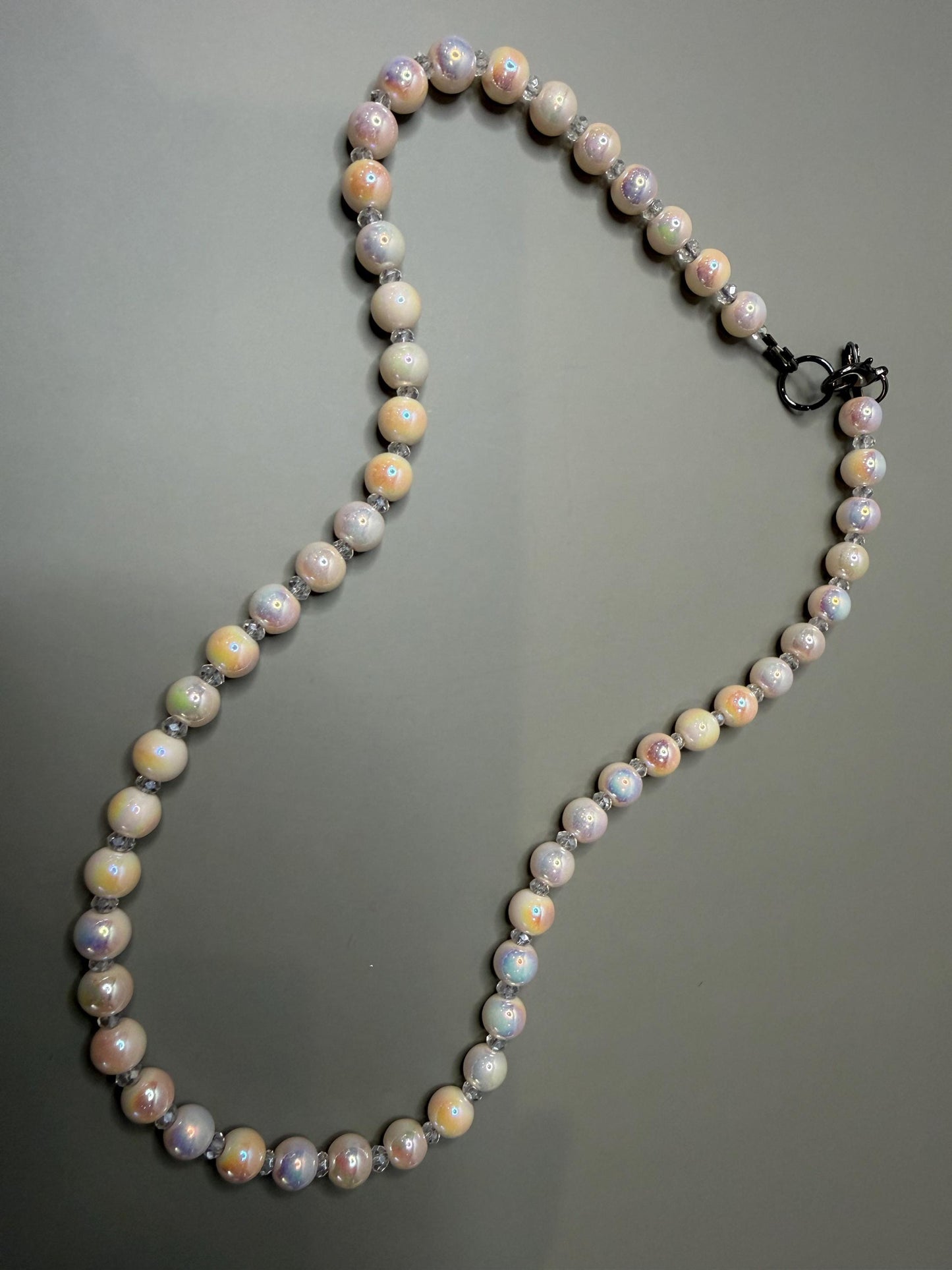 Pearl necklace on a gray background