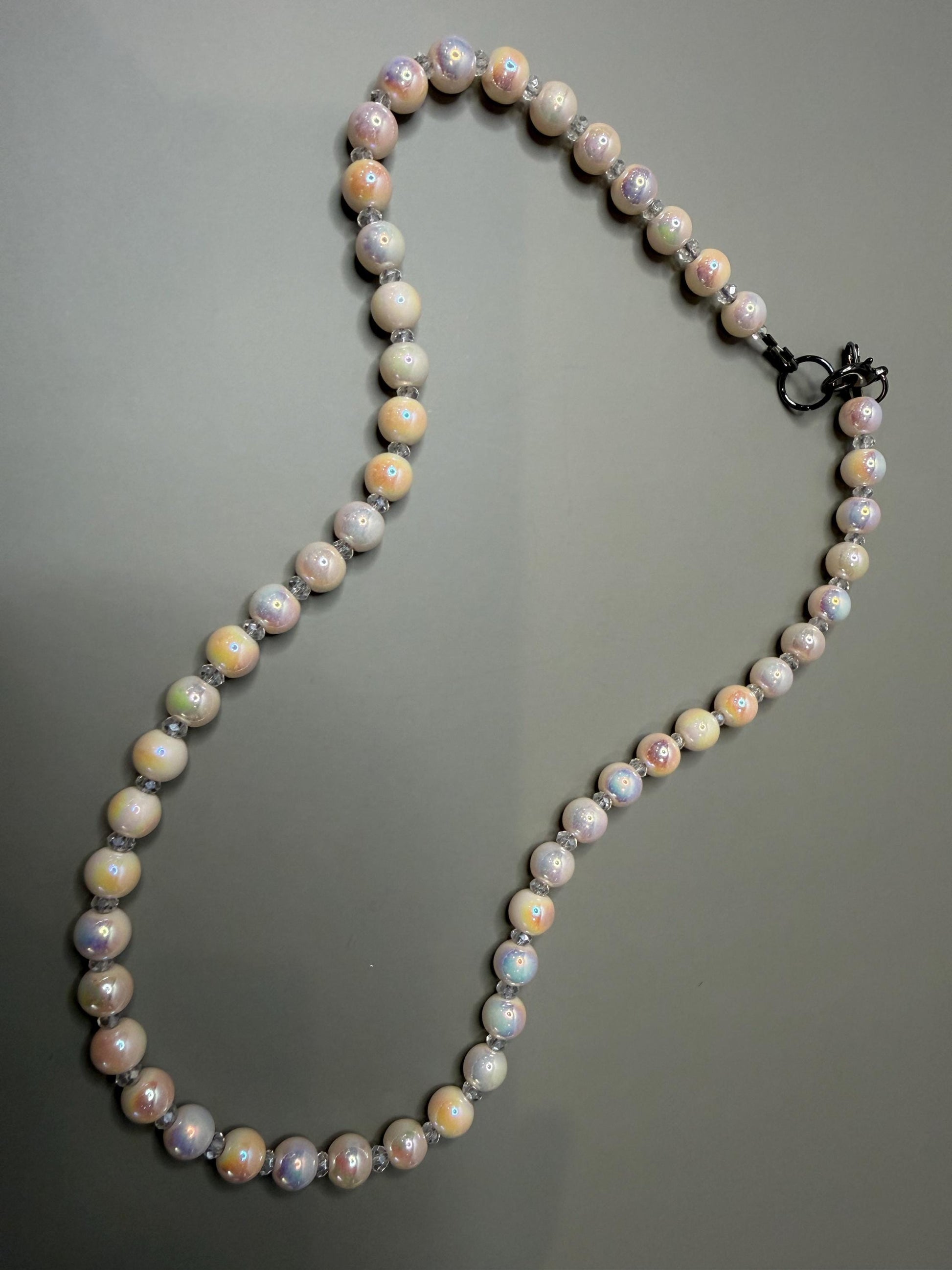 Pearl necklace on a gray background