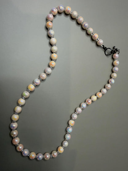 Pearl necklace on a gray background