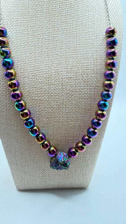 Necklace with iridescent beads on a white background