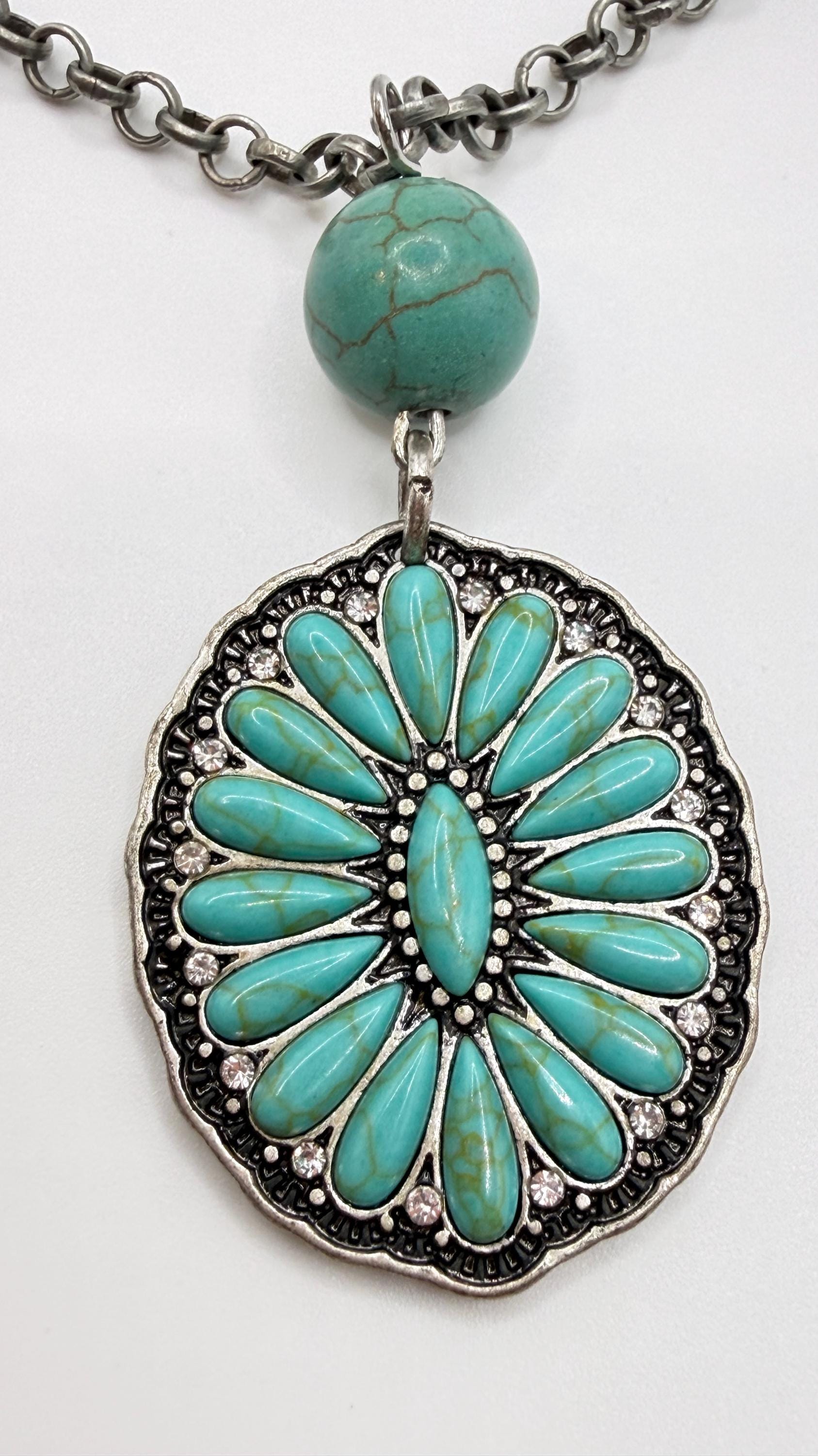 Turquoise pendant necklace on a white background