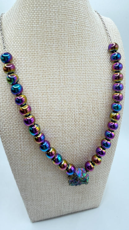 Necklace with multicolored beads on a beige bust