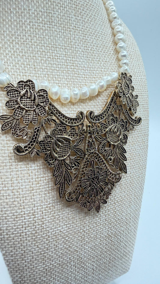 Decorative necklace with floral patterns on a white background